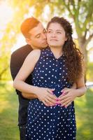 Hispanic Pregnant Young Couple Portrait Outdoors photo