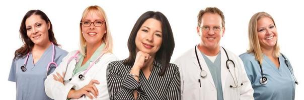 Hispanic Woman with Male and Female Doctors or Nurses photo