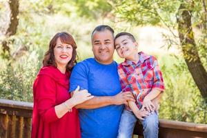 Mixed Race Caucasian and Hispanic Family At The Park. photo