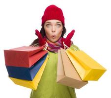 Mixed Race Woman Wearing Hat and Gloves Holding Shopping Bags photo