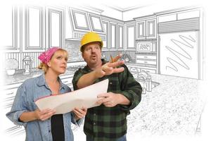 Contractor Talking with Customer Over Kitchen Drawing photo