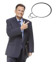 Businessman Pointing to the Blank Thought Bubble on White photo