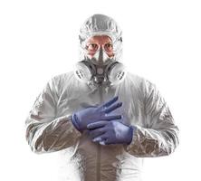 Man Wearing Hazmat Suit, Goggles and Gas Mask Isolated On White. photo