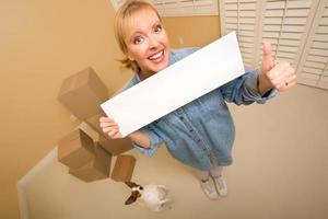 Woman and Doggy with Blank Sign Near Moving Boxes photo