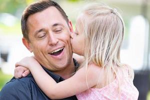 Young Caucasian Father and Daughter Having Fun At The Park photo