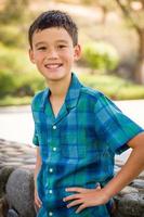 Outdoor portrait of a biracial Chinese and Caucasian boy. photo