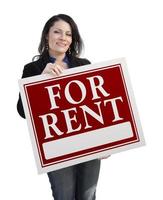 Hispanic Woman Holding For Rent Sign On White photo