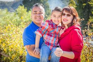 Mixed Race Caucasian and Hispanic Family At The Park. photo