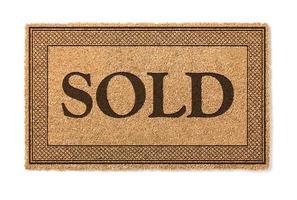 Sold Welcome Mat Isolated On A White Background photo