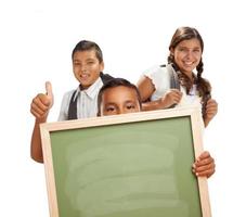 Students with Thumbs Up Holding Blank Chalk Board on White photo