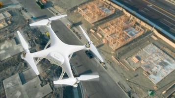 Unmanned Aircraft System UAV Quadcopter Drone In The Air Over Construction Site. photo