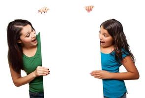 Pretty Hispanic Girl and Mother Holding Blank Board photo