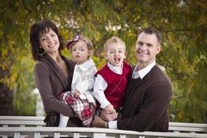 Young Attractive Parents and Children Portrait in Park photo