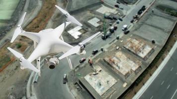 Unmanned Aircraft System UAV Quadcopter Drone In The Air Over Construction Site. photo