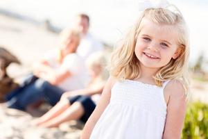 Adorable Little Blonde Girl Having Fun At the Beach photo