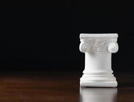 White Ionic Design Column on Dark Background photo