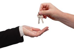 Man Handing Over Woman Set Of Keys photo