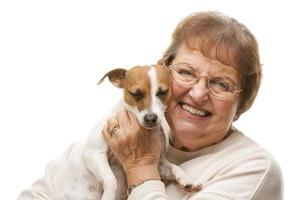 Happy Attractive Senior Woman with Puppy photo