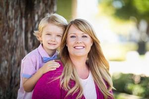Young Caucasian Mother And Daughter Portrait At The Park photo