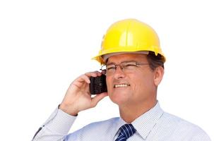 Contractor in Hardhat on His Cell Phone Isolated photo