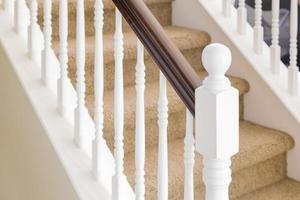 Abstract of Stair Railing and Carpeted Steps in House photo