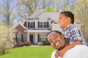 Mixed Race Father and Son In Front of House photo
