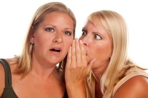 Two Blonde Woman Whispering Secrets photo