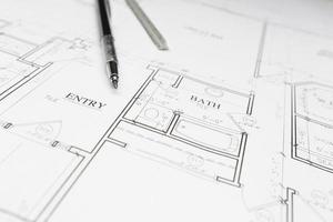 Engineer Pencil and Ruler Resting on House Plans photo