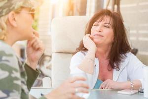 Two Female Friends Enjoying Conversation Outside photo