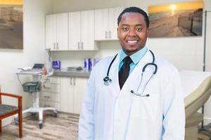 African American Male Doctor Standing In Office photo