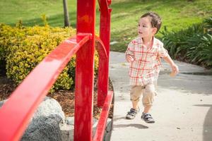 Young Chinese and Caucasian Boy Having Fun at the Park. photo