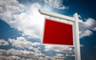 Blank Red Real Estate Sign Over Sky photo