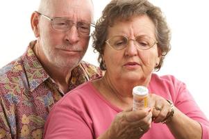 Senior Couple with Prescription Bottle photo