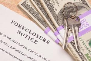 House Keys, Stack of Money and Foreclosure Notice photo