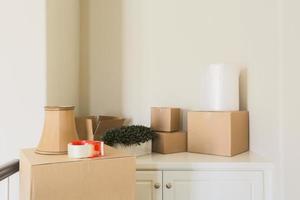 Variety of Packed Moving Boxes In Empty Room photo