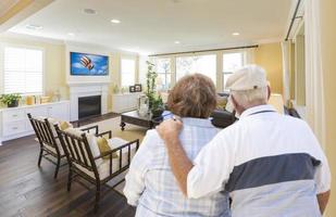 Senior Couple Overlooking A Beautiful Living Room photo