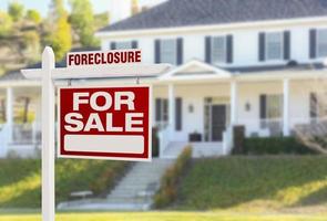 Foreclosure Home For Sale Sign in Front of Large House photo