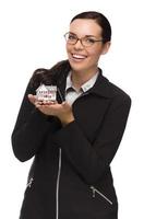 Mixed Race Woman Holding Small House Isolated on White photo