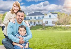 Mixed Race Family Portrait In Front of House photo