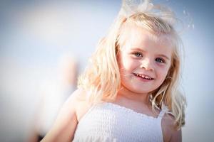 Adorable Blue Eyed Girl Playing Outside photo