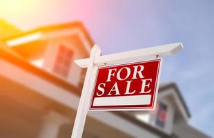 Home For Sale Real Estate Sign in Front of House photo