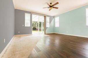 Empty Room with Cross Section Showing Before and After With New Wood Floor and Paint photo