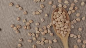 Chickpeas legumes, wooden spoon, vegan vegetarian protein source ingredient, Mediterranean healthy diet chickpea video