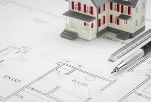 Model Home, Engineer Pencil and Ruler Resting On House Plans photo