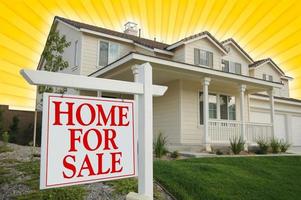 Home For Sale sign with Yellow Star-burst Background. photo