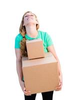 Tired Young Adult Woman Holding Moving Boxes Isolated On A White Background. photo