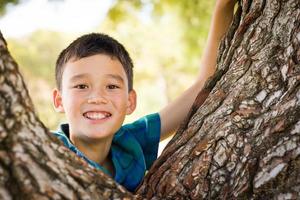 Outdoor portrait of a biracial Chinese and Caucasian boy. photo