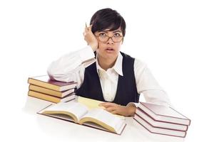 Bored Mixed Race Female Student at Desk with Books photo