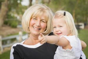 Grandmother and Granddaughter Playing At The Park photo