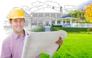 Male Contractor Wearing Hard Hat In Front of House Drawing Gradation Into Photograph. photo